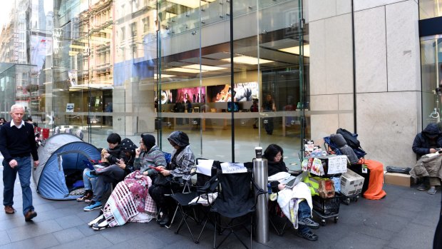 Tent city: iPhone fans (and those working as place holders) outside Apple's Sydney store in George St on Friday morning.