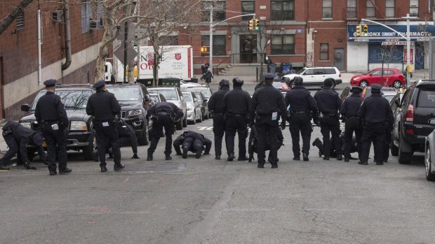 New York police sweep the site of the Bronx shooting.