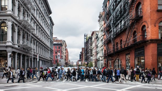 Tourists and shoppers flock to SoHo, New York City.