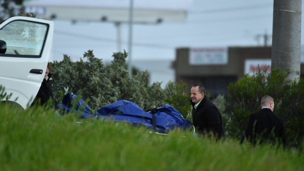 Police recovering the body found in bushes near Mahoneys Road, Fawkner.