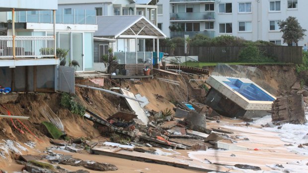 The Collaroy homes, including Mr Silk's at left, and the smashed pool, in the immediate wake of the storm.