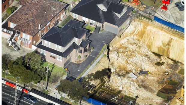 Two townhouses were left perching  on the edge of the excavation in Mount Waverley in July 2015. 