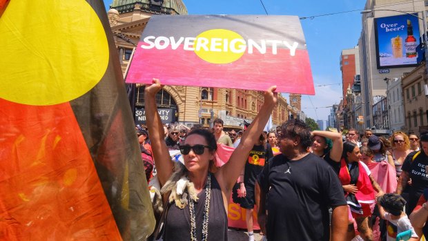 Aboriginal and pro-Aboriginal protestors march through Melbourne on January 26.