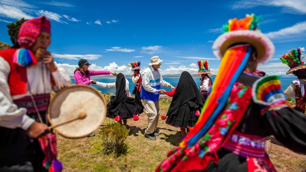 Tourists and locals at Taquille Lake Titicaca.