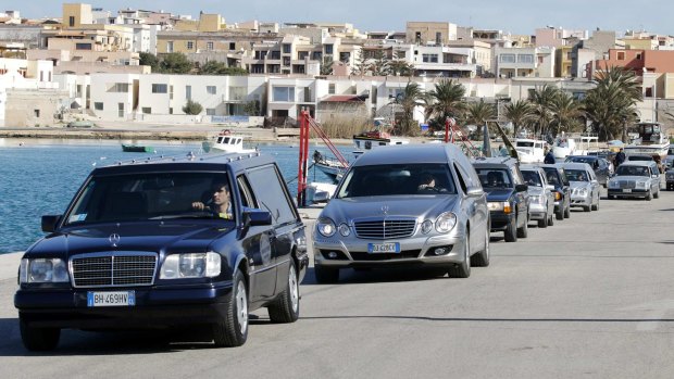 Hearses arrive at  Lampedusa harbour.