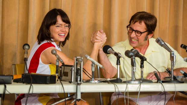 Emma Stone and Steve Carell as Billie Jean King and Bobby Riggs, hamming it up for the cameras in Battle of the Sexes.