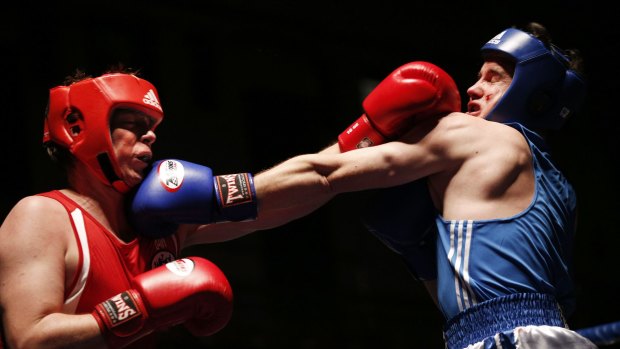 White-collar workers in the boxing ring fight for three two-minute rounds. 