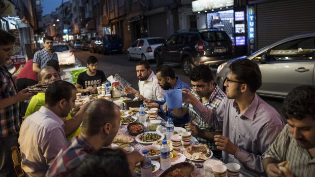 Diners breaking their Ramadan fast in Professor Naci Sensoy Street in June.
