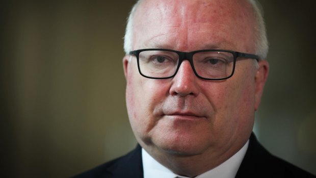 Attorney-General George Brandis will introduce new laws that crack down on foreign interference in Australian politics.