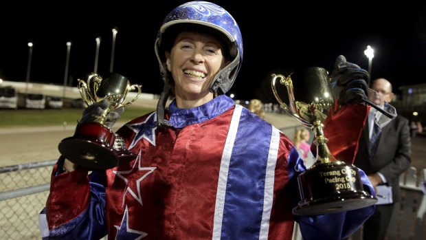 Kerryn Manning accepts the trophies after winning the Terang Pacing Cup with Arden Rooney. 