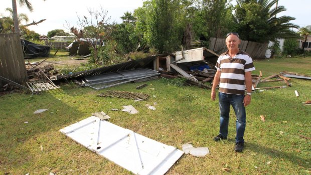 Kurnell resident Bill Byast shows the storm damage in his backyard.