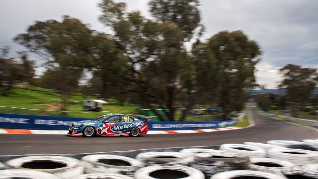 Craig Lowndes drives during practice.