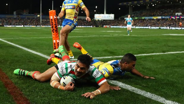 Slippery slope: Kirisome Auva'a goes over as the Rabbitohs start to reel in the Eels.