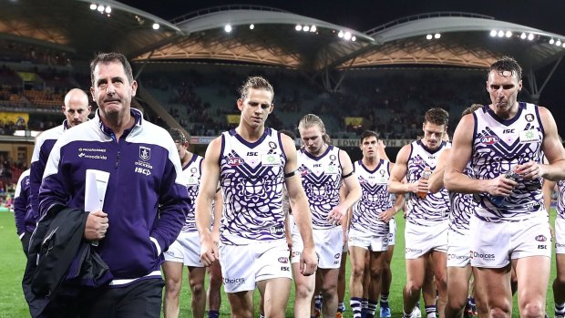 Ross Lyon leads the Dockers from the ground after their big loss.