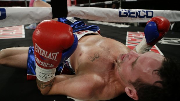Flat out: Daniel Geale on the canvas after being knocked down by Miguel Cotto during the fourth round.