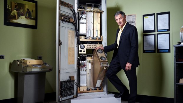 Leonard Kleinrock stands next to a specialised computer — a forerunner to today's routers — that sent the first message over the internet in 1969.