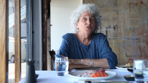 Marion Nestle prepares to tuck into the interviewer's sashimi.