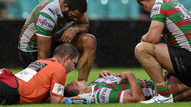 Scary scenes: Sam Burgess receives medical attention last Sunday.