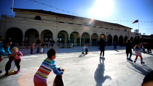 Skaters enjoying the rare sensation of gliding on ice within yards of the sand on the beach at the Bondi Ice Rink.