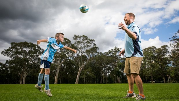 Adam Hollingworth – football coach and dad – has been told to sign a contract that allows the FFA free use of his name and image, or walk away from his son Tully's team.
