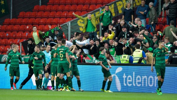 Celtic players celebrate James Forrest's goal.