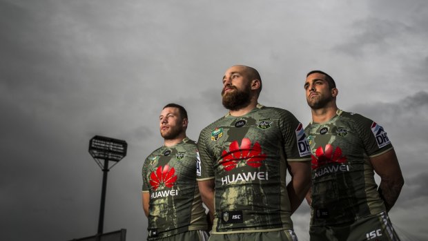 Canberra Raiders players Shannon Boyd, Kurt Baptiste, and Paul Vaughan wear the Anzac day kit at Canberra Stadium on Tuesday.  