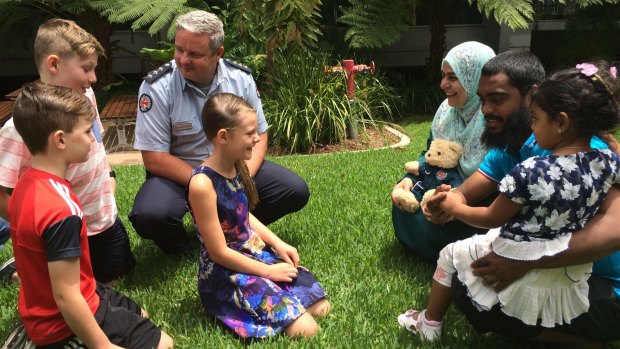 The Hanaberry and Hassain families reunited after Sara Hussain's near-drowning at Bribie Island.