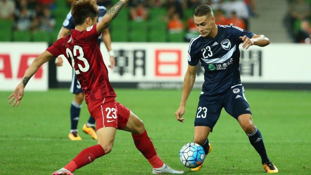 Huan Fu of Shanghai SIPG challenges Jai Ingham of Melbourne Victory during the AFC Asian Champions League match on Wednesday.