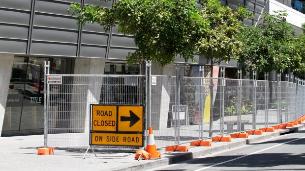 Much of the fencing around Brisbane's CBD will be gone by Monday morning. 