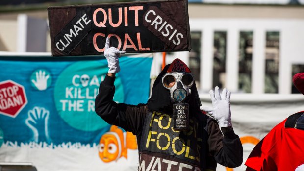 Protestors gather at Federal Parliament this week to oppose the Adani coal mine.