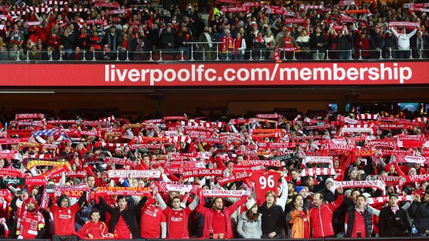 Liverpool fans sign <i>You'll Never Walk Alone</i> at Adelaide Oval.