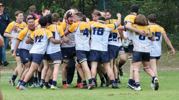 The ACT schoolboys celebrate after beating Queensland for first time since 2000 at the rugby national championships in Sydney. 