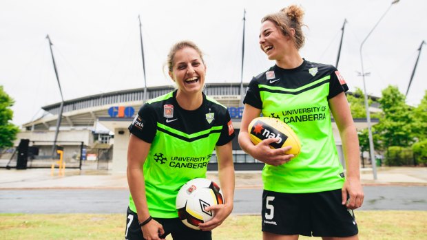 Canberra United players Ellie Brush and Jenna McCormick outside Canberra Stadium.