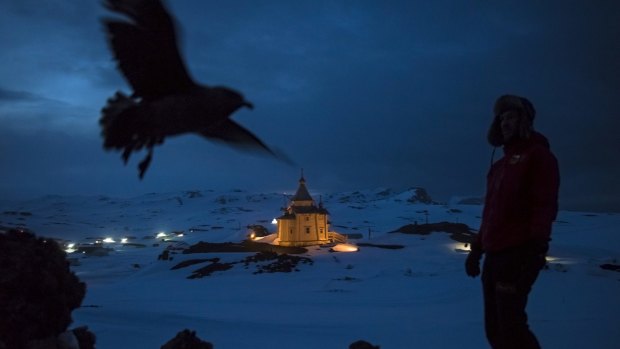 Chilean scientist Ernesto Molina near the Russian Orthodox Church of the Holy Trinity on King George Island, Antarctica.