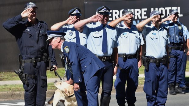 Mr Scipione gives one of the police dogs a last pat.