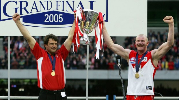 Swans coach Paul Roos and captain Barry Hall hold the trophy aloft after the 2005 AFL grand final against the West Coast Eagles.