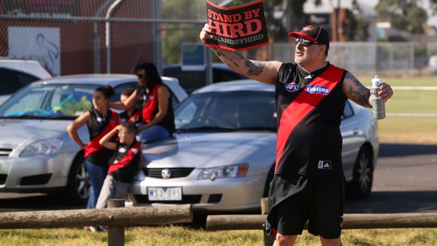 A Bombers fan shows his support for James Hird near the club's headquarters on Tuesday.