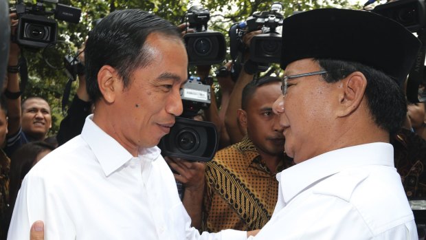 Joko Widodo (left) and his rival for the presidency, Prabowo Subianto, in October 2014. 
