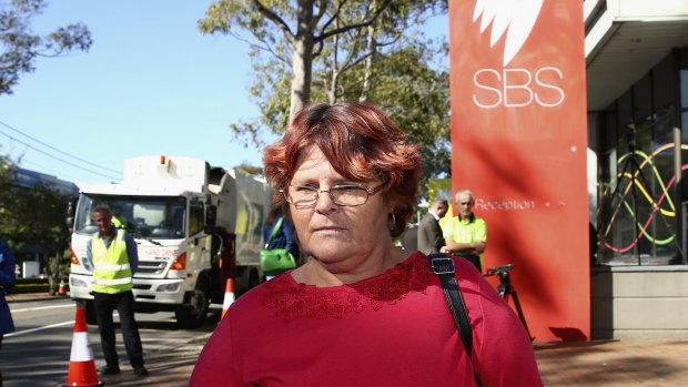 Mt Druitt resident and <i>Struggle Street</i> subject Peta Kennedy stands outside SBS as rubbish trucks blockade the broadcaster in protest.