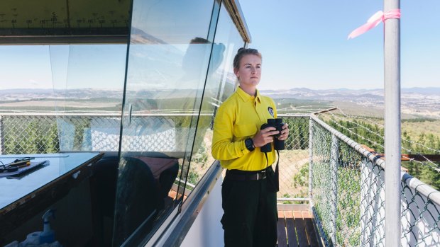 Seasonal firefighter Kirsty Babington at the Kowen Forest fire tower overlooking Canberra's surrounds.