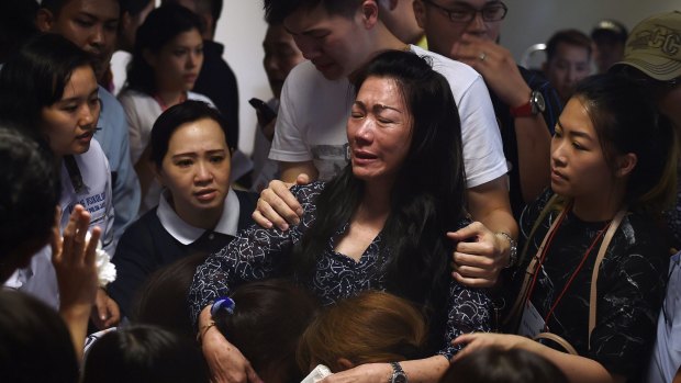 Family members of passengers onboard AirAsia flight QZ8501 inside the crisis centre set up at Juanda International Airport in Surabaya.