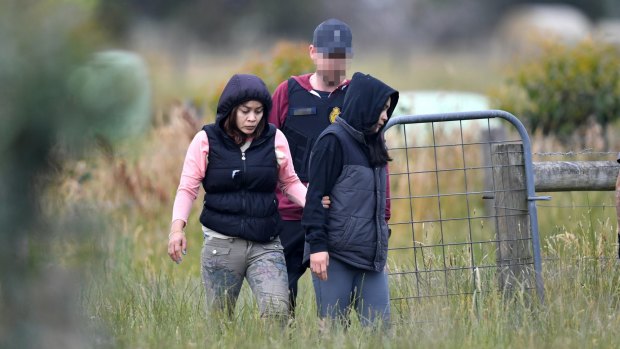 A Border Force official arrests workers.