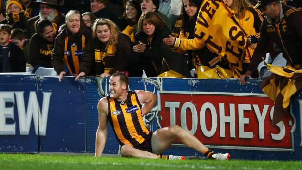 Ouch: Jarryd Roughead holds his back after being pushed by Dane Rampe after kicking a goal.