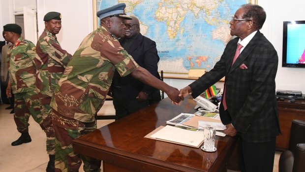 Zimbabwean President, Robert Mugabe, right, meets Defence Forces generals in Harare at State House on Sunday.  