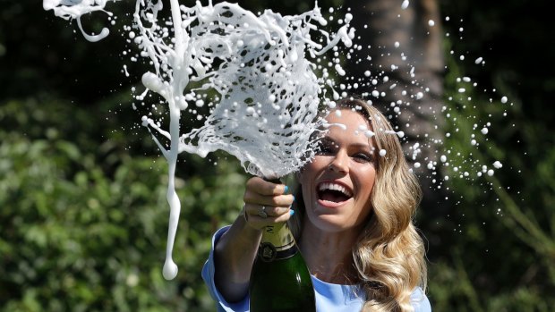 Caroline Wozniacki celebrates with champagne on Sunday.
