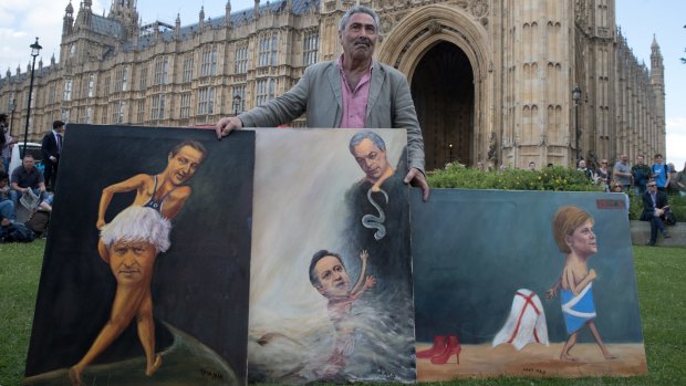 Satirical artist Kaya Mar poses with Brexit-themed artwork depicting Prime Minister David Cameron, former London Mayor Boris Johnson, Leader of the UKIP, Nigel Farage, and leader of the Scottish National Party (SNP), Nicola Sturgeon in London