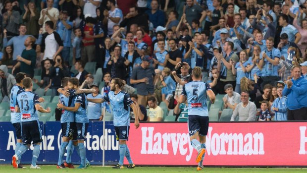 Milos Ninkovic celebrates in front of the Sydney FC fans.