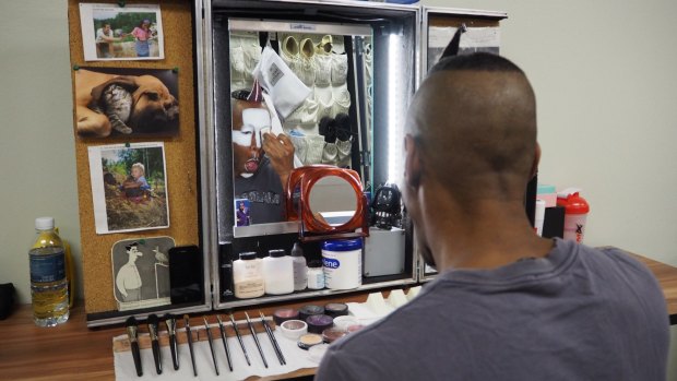 Veteran performer Mark Ward spends two hours before each show applying layers of make-up .