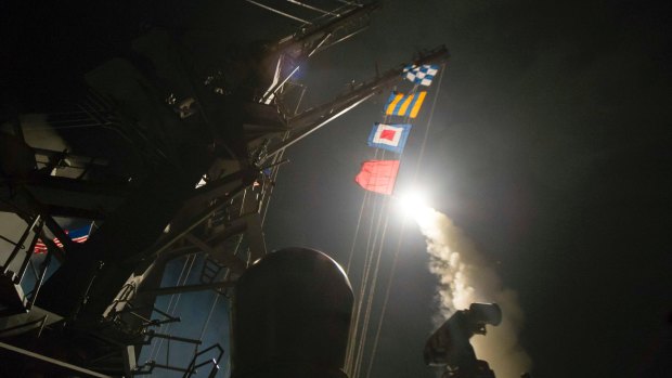 The USS Ross fires a Tomahawk missile at Syria from the Mediterranean Sea. 