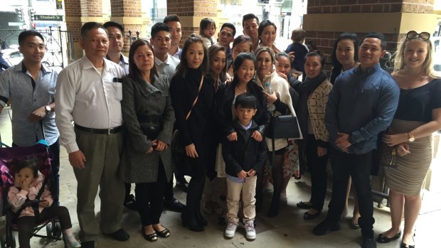 The family of murder accused Nou Loeung, including his wife Shirley (in white coat), gasped and cried as he was granted bail in the Supreme Court.